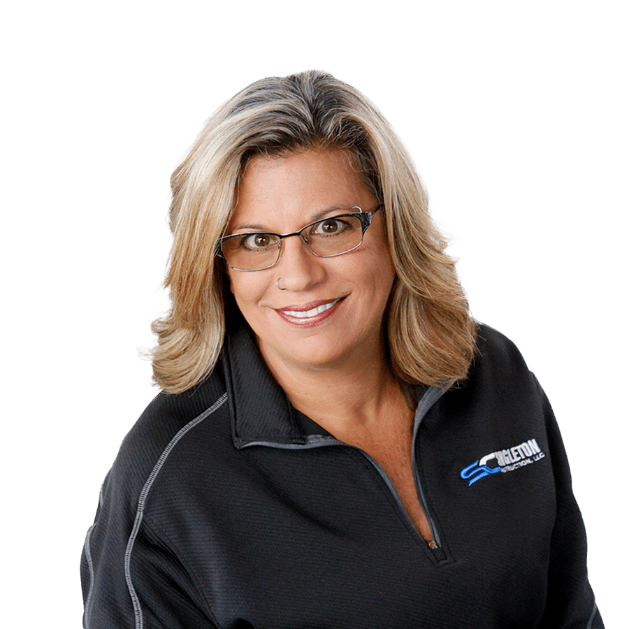 A woman wearing glasses and a black jacket.